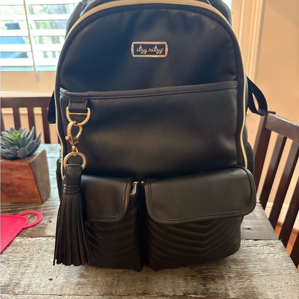 Itzy Ritzy Black Backpack with Gold Accents and Tassel